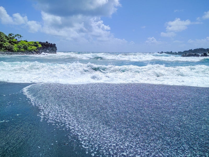 View of ocean from a black sand beach