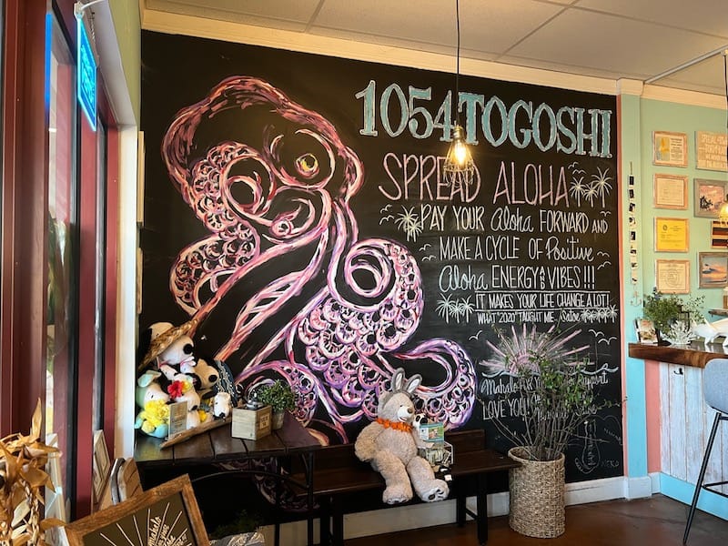 chalkboard wall with octopus drawing and text