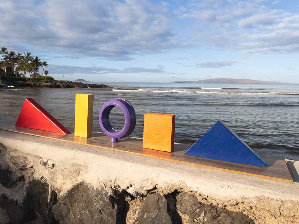Colorful Aloha sign overlooking the ocean at Kihei, Maui