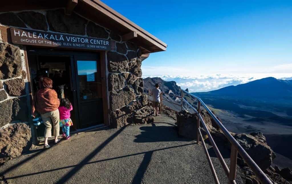 The entrance to Haleakala Visitor Center with views of the clouds and crater.