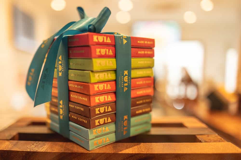 A stack of large Kuia Chocolate bars wrapped in a ribbon at the factory store in Lahaina, Maui