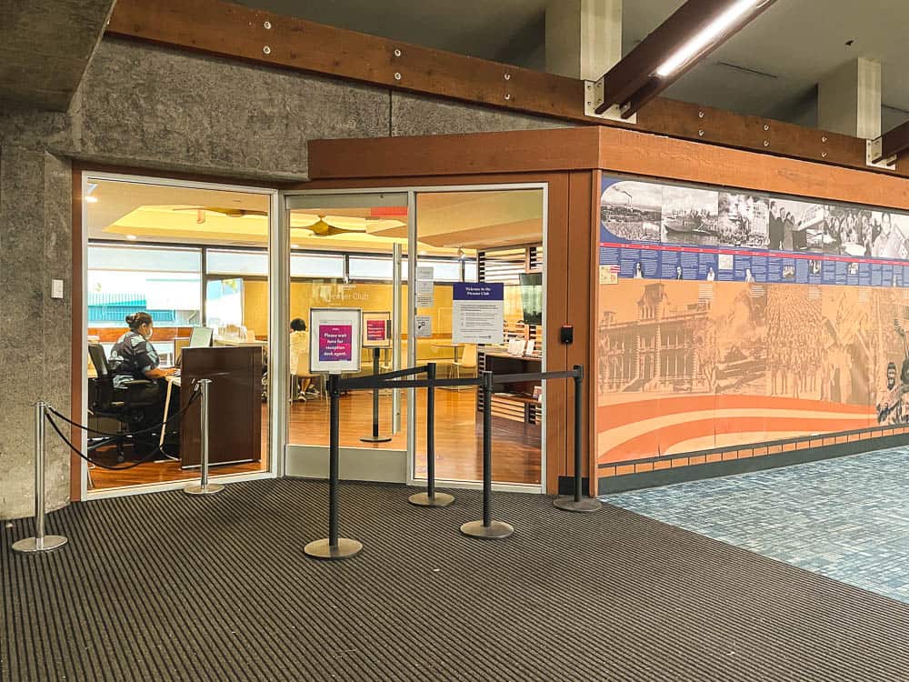 A glass door leading to the Hawaiian Airlines lounge at Maui's Kahului Airport (OGG)