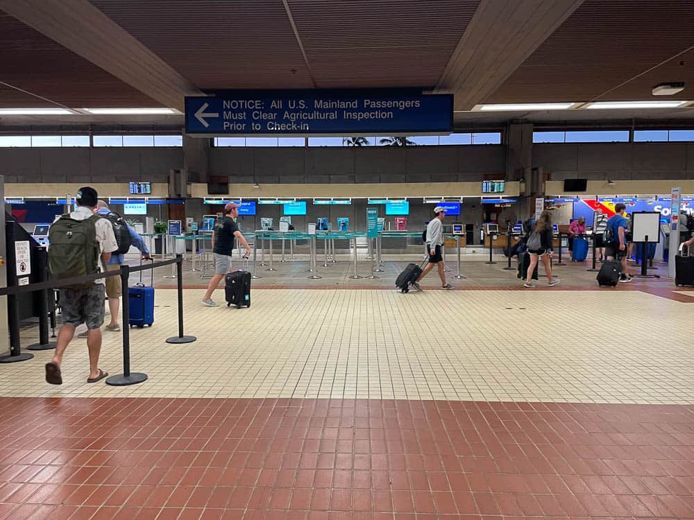 Airline service desks at the Kahului Airport check-in area