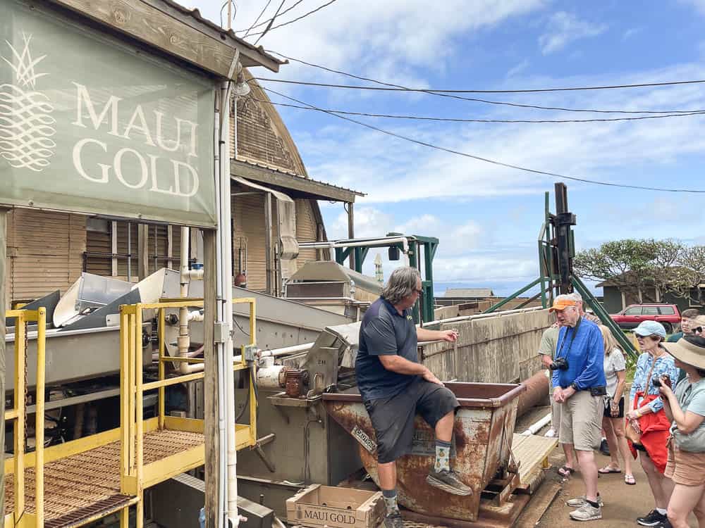 A group tour in front of the Maui Gold sorting facility in Makawao