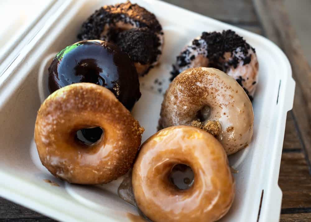 An open takeout box filled with six donuts from Maui Ono Donuts, Hawaii