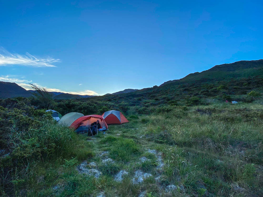 Four tents on the grassy Paliku campsite at Haleakala National Park