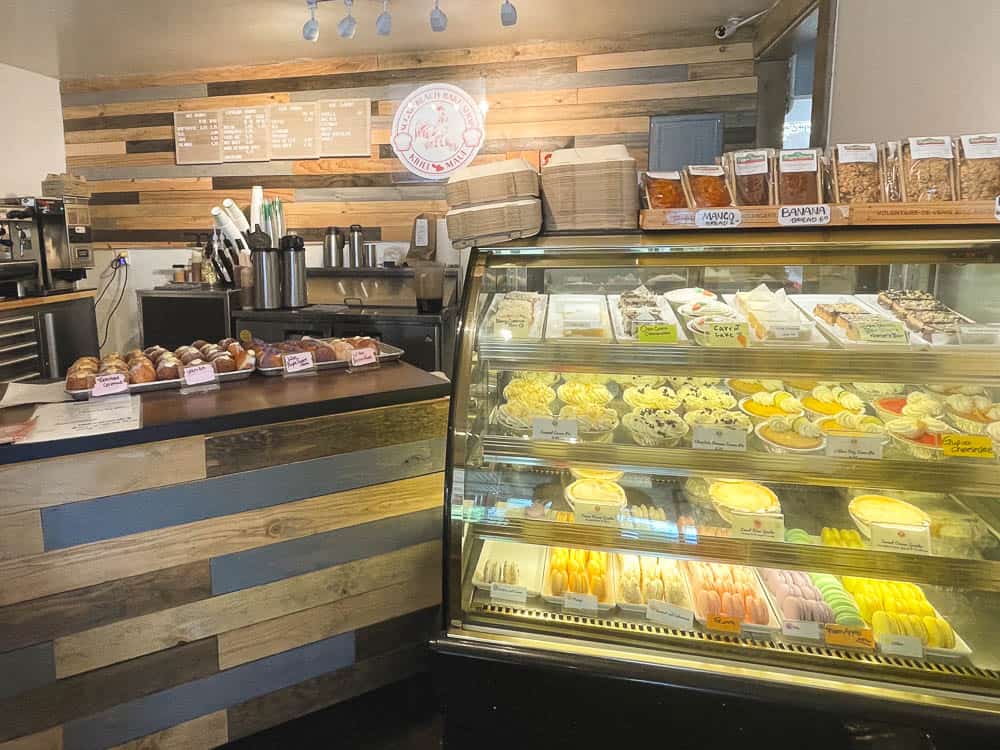 The pastry-filled bakery case and counter of Sugar Beach Bake Shop in Kihei Maui